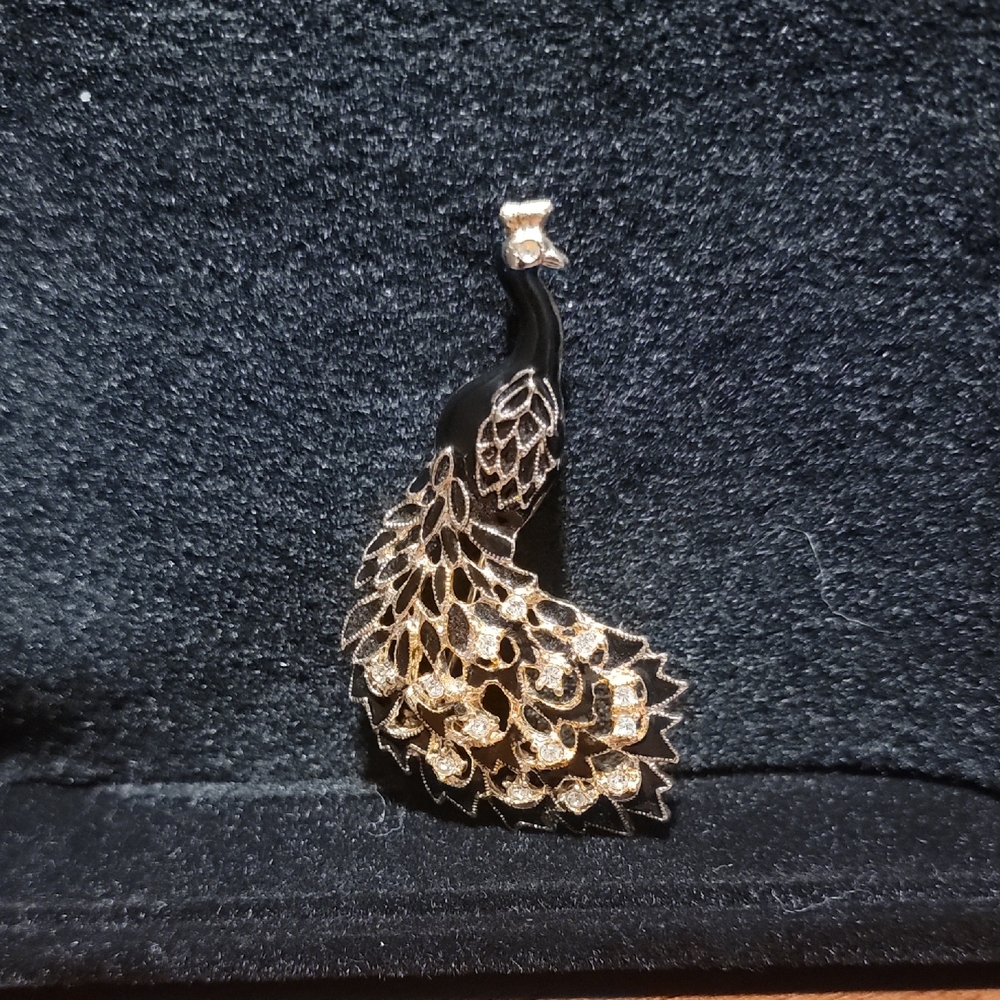 Elegant Black and Gold Peacock Pendant